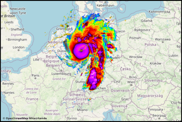 Das Bild zeigt eine farbverstärkte Satellitenaufnahme eines tropischen Wirbelsturms, der visuell über eine Karte von Deutschland gelegt wurde. Die Struktur des Sturms mit ausgeprägtem Auge und spiralartigen Regenbändern ist deutlich zu erkennen. Die Falschfarbendarstellung nutzt intensive Farben wie Violett, Rot, Orange und Grün, um unterschiedliche Temperatur- oder Niederschlagszonen hervorzuheben. Die Überlagerung suggeriert symbolisch die Ausdehnung oder Auswirkung eines Tropensturms namens …