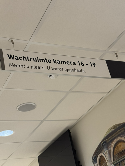 In Dutch: Neemt u plaats. U wordt opgehaald. 