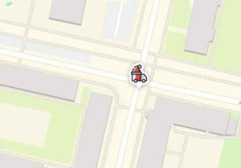 Auf einer stilisierten Karte mit Gebäuden und Straßen ist ein kleines rotes Fahrzeug mit Weihnachtsmütze zu sehen, das sich an einer Kreuzung befindet. Das Fahrzeug ist im Comic-Stil dargestellt und hebt sich deutlich vom hellen Hintergrund der Karte ab. Die umliegenden Gebäude sind in Grau gehalten, Grünflächen sind blassgrün dargestellt und Straßen mit gepunkteten Linien markiert.