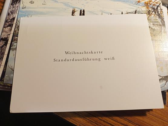 Weiße Postkarte mit Aufschrift: Weihnachtskarte Standardausführung weiß 