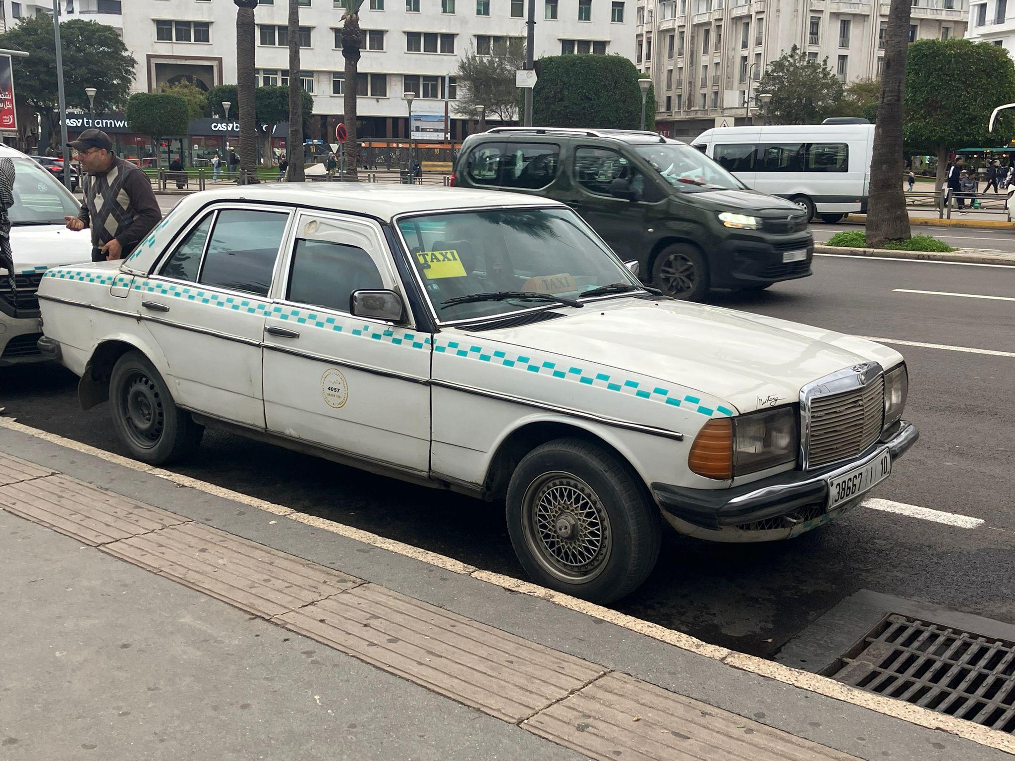White Moroccan Mercedes W123 taxi, side view