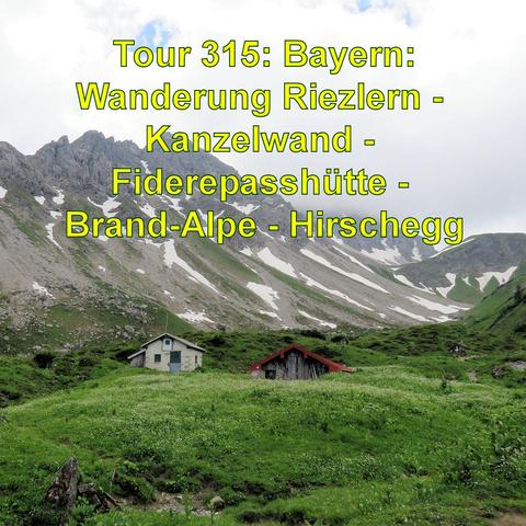 Zwei kleine Almhütten in einer alpinen Landschaft, die eine grün gestrichen und die andere aus rotem Holz, eingebettet in eine grüne, blühende Wiese. Im Hintergrund erheben sich felsige Bergspitzen, an deren Hängen noch Schnee liegt. Die Szene ist von Wolken bedeckt Die Hütten wirken verlassen und tragen zur Atmosphäre der Abgeschiedenheit und Ruhe in dieser Bergkulisse bei.