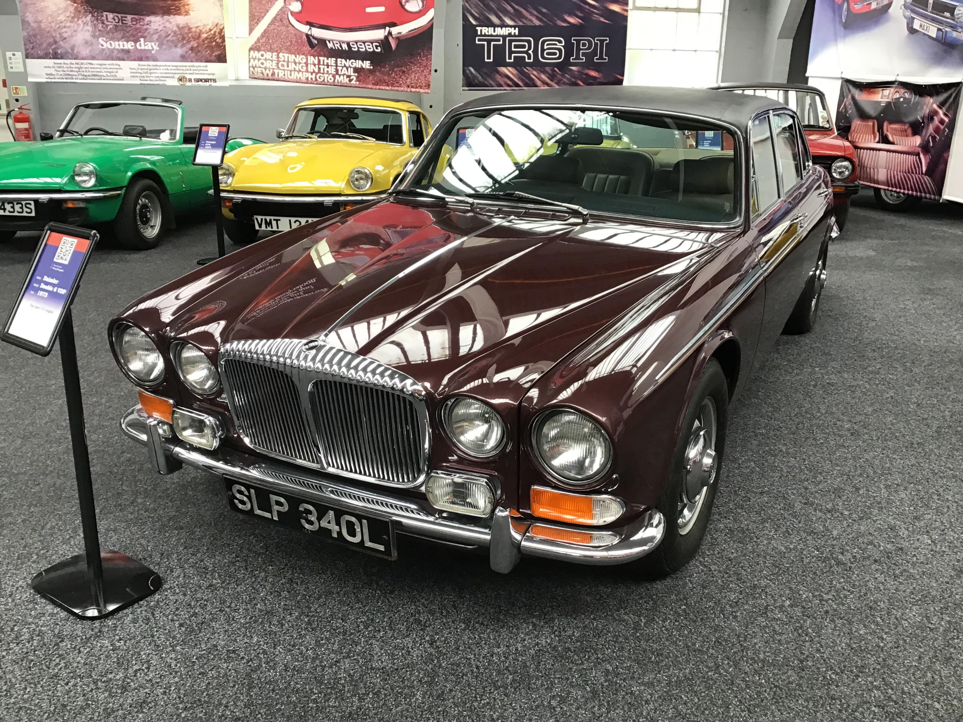 Maroon Daimler Double Six Vanden Plas with black vinyl roof, front quarter view