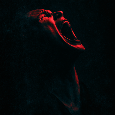 A man’s face twists upward, wailing toward the heavens in a crimson glow, alone, in agony.