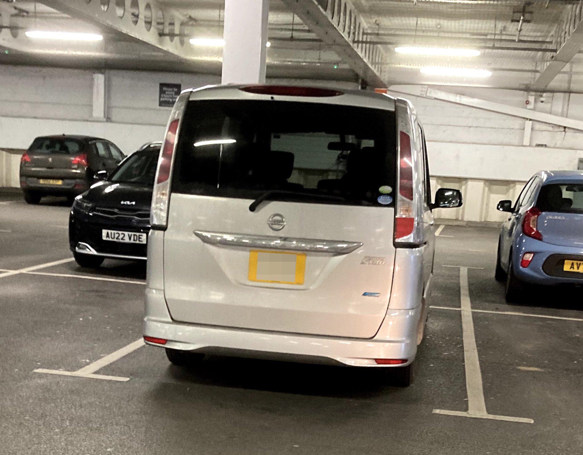 Silver Nissan Serena, rear view