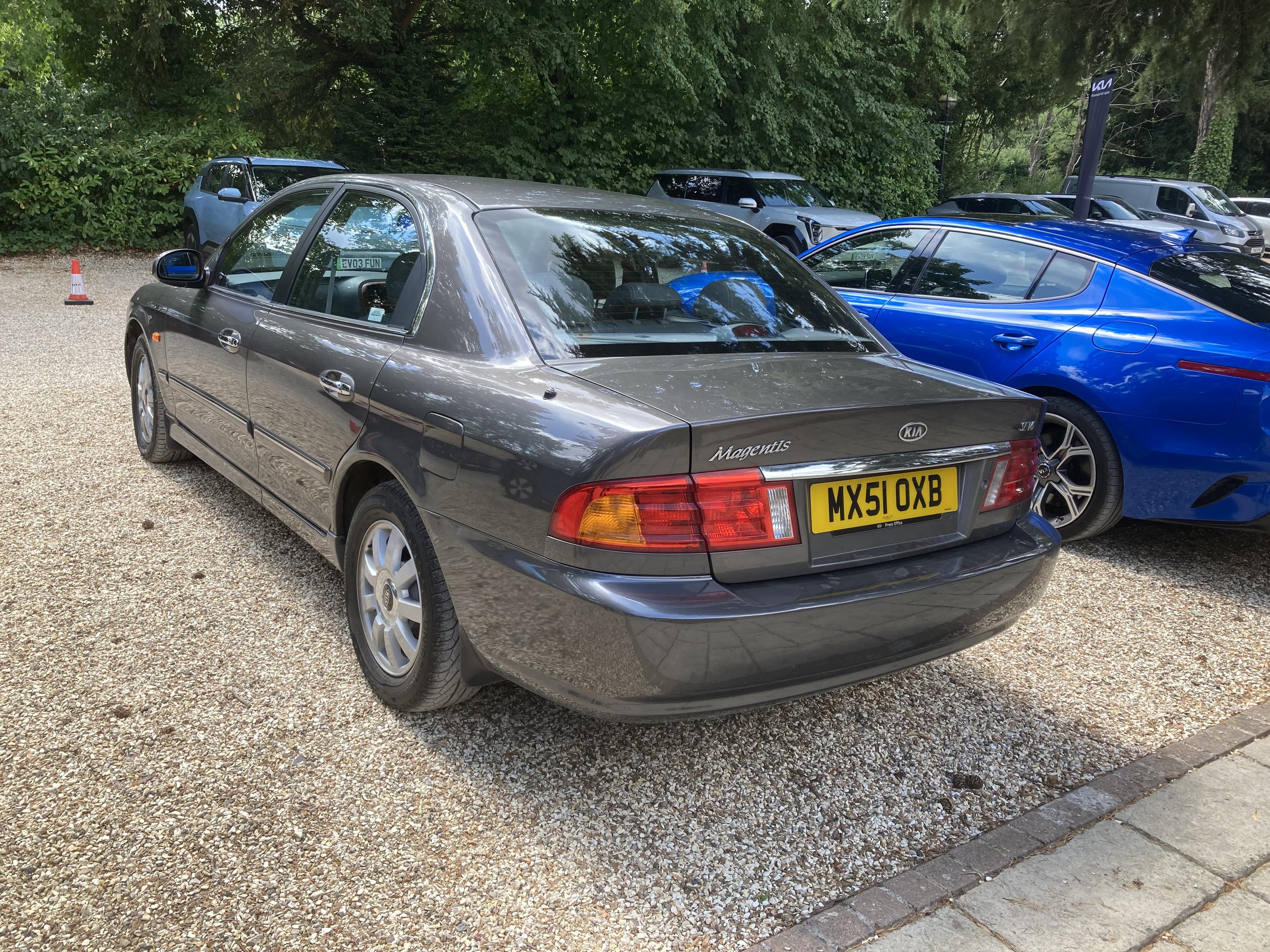 Grey metallic Kia Magentis, rear quarter view