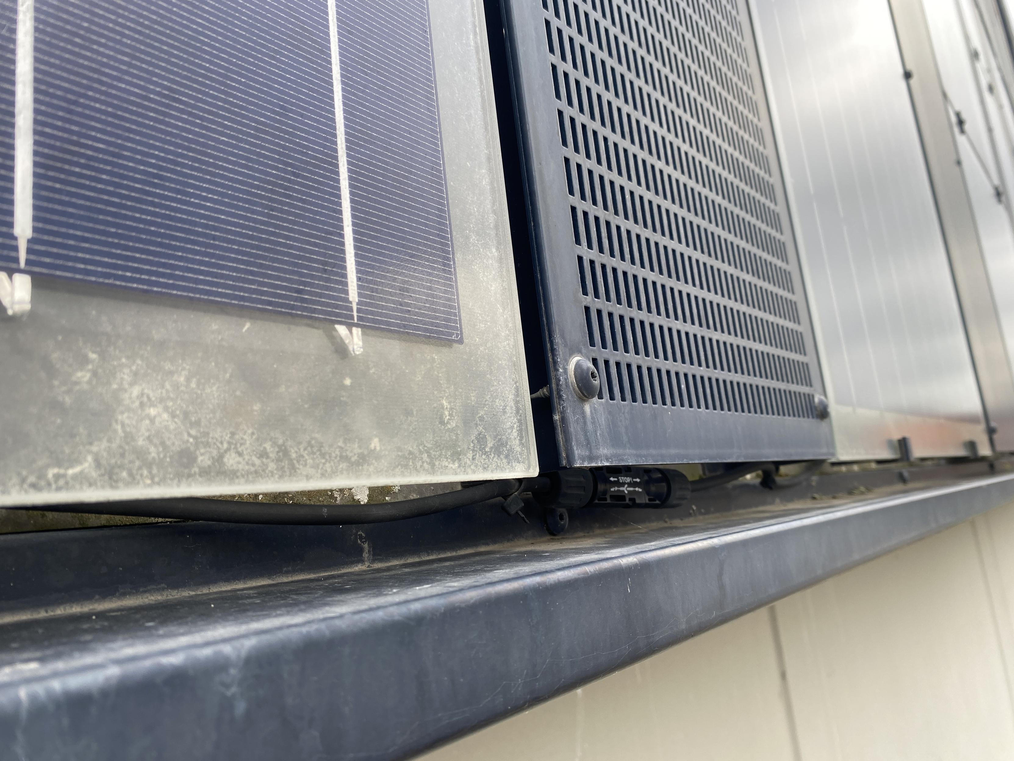 Up close. I see MC4 connectors and cabling. Probably functional