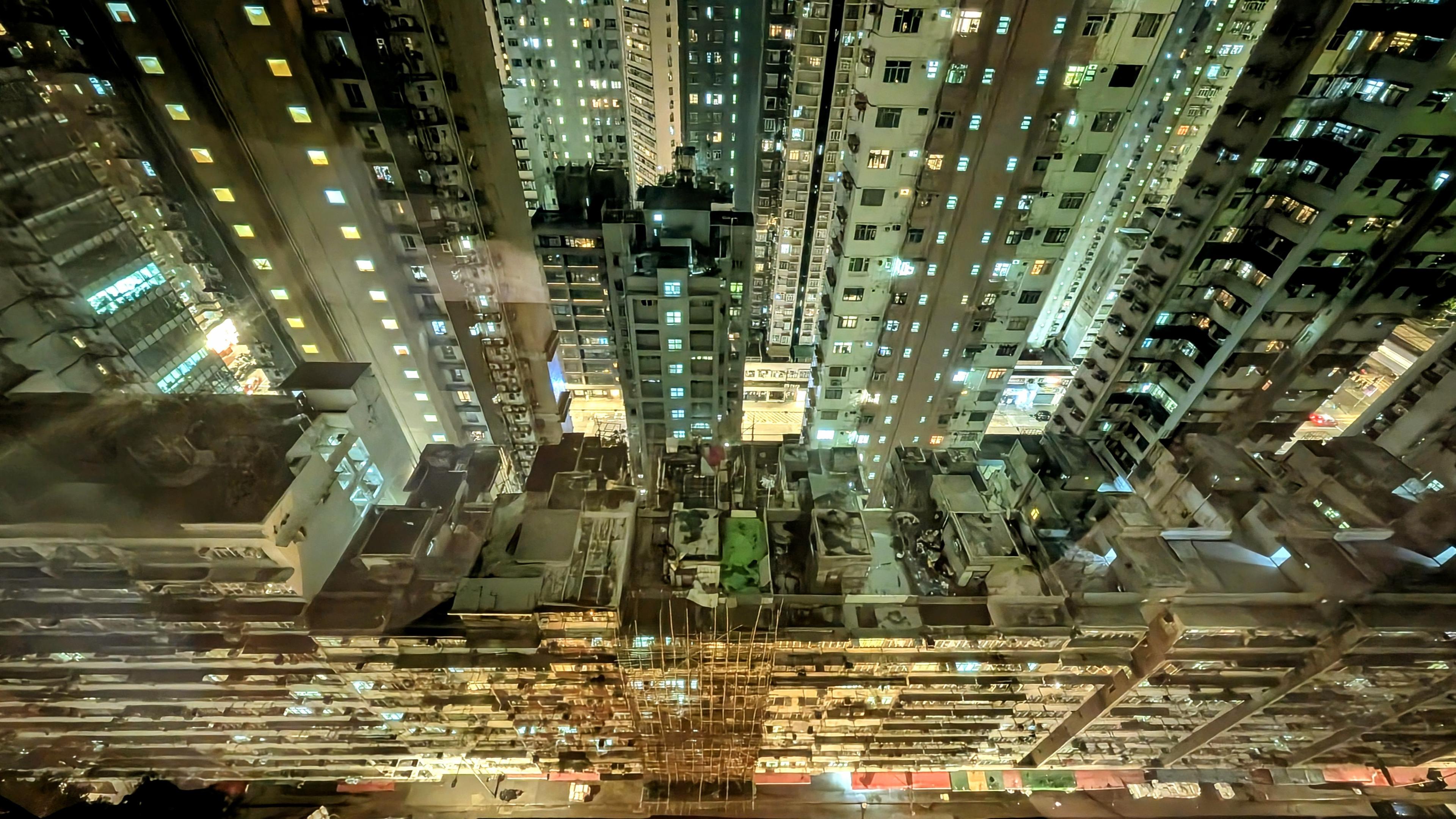 Colour photo of a view from our hotel room window on the 36th floor in Hong Kong.
Image shows how dense the high rise buildings can get. It felt like I was trapped somehow. At the bottom of the photo is the street where the local market is. Taken around 5am, the market is already a hive of activity, mainly selling fruit, vegetables, fish and meat amongst other things.
