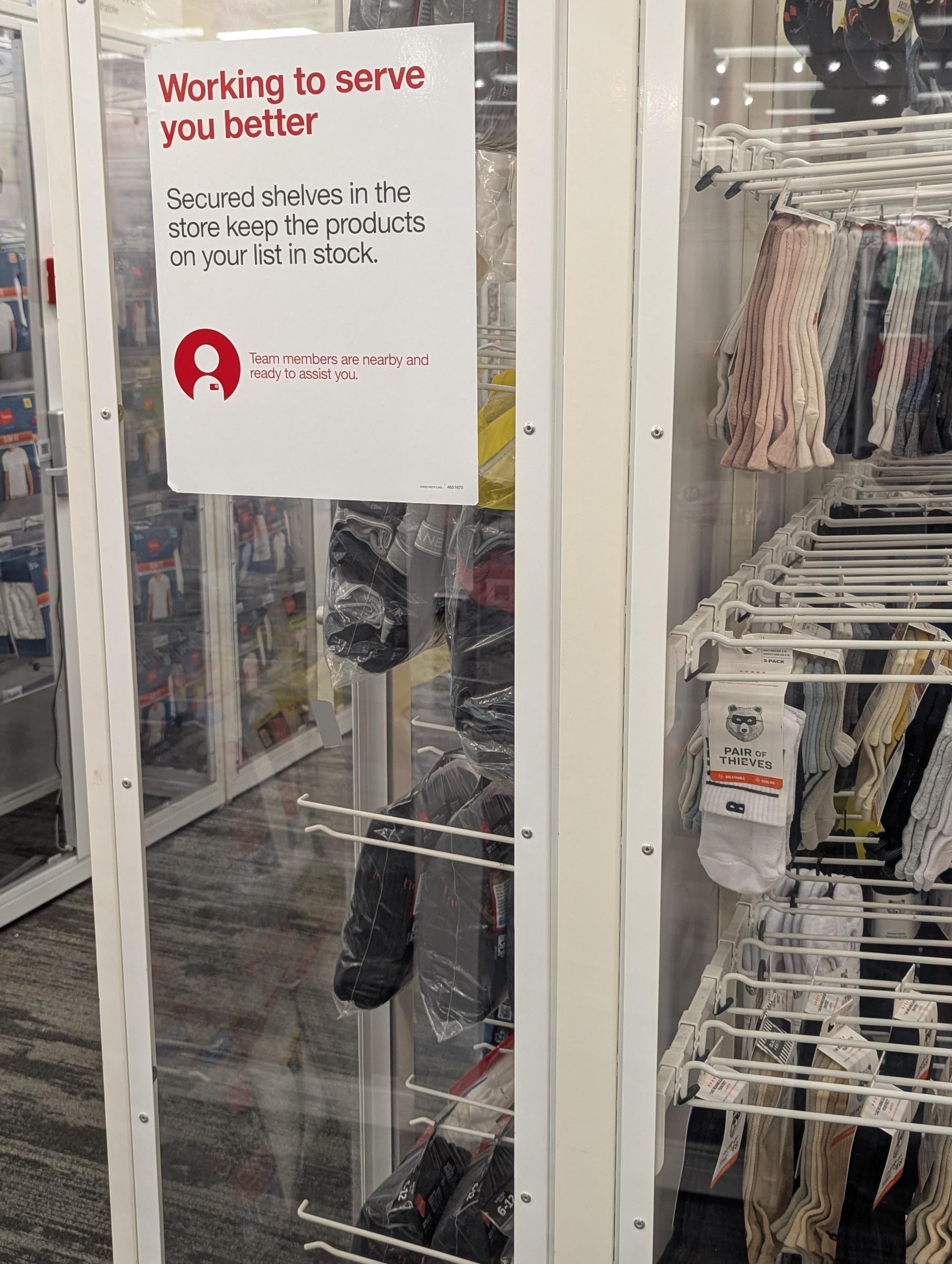 Locked up underwear and socks, with sign and "pair of theives" socks