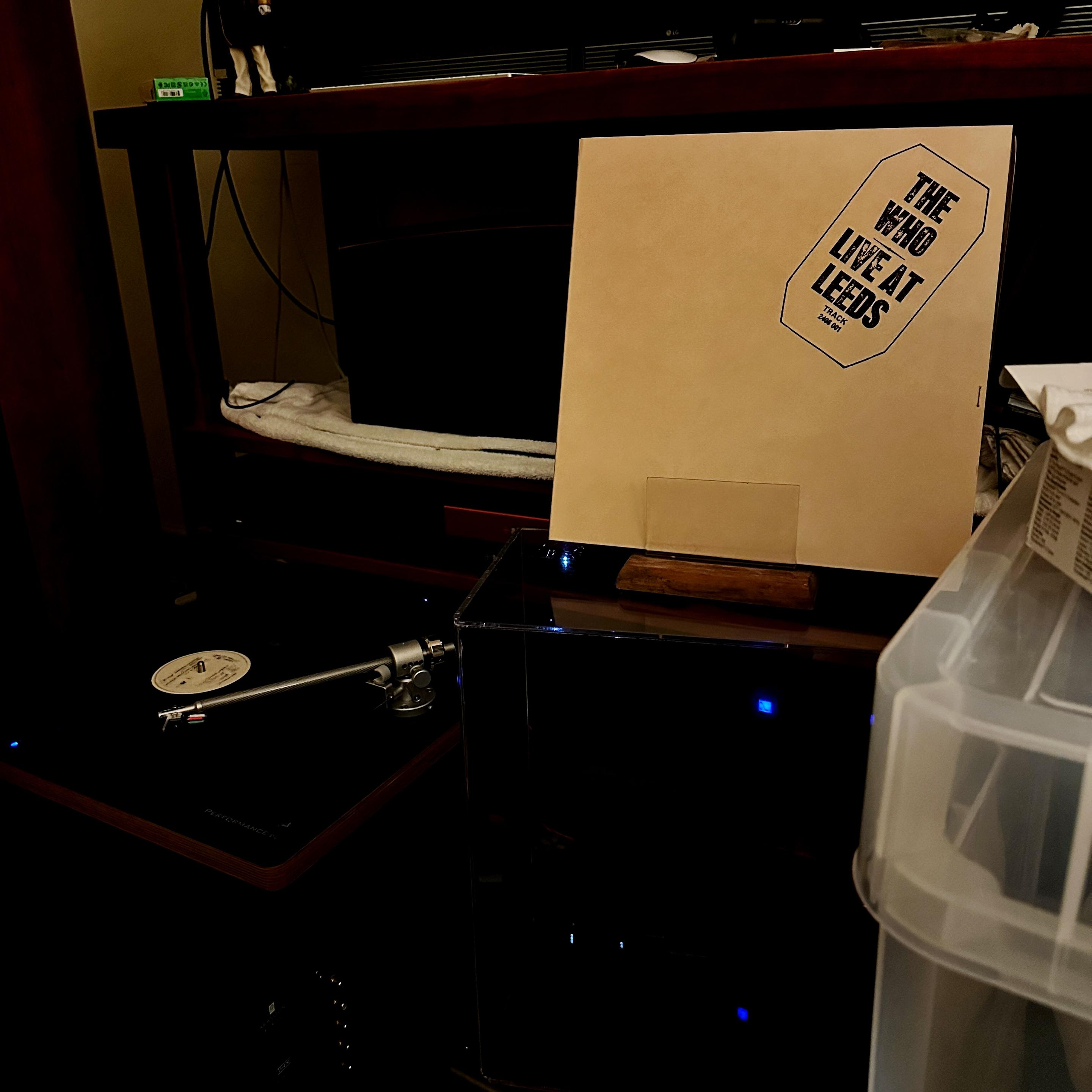 My Now Playing prop with The Who’s ‘Live at Leeds’ album cover. It’s a manilla square with the title looking a bit like a stamp in the upper left corner. Aside from that, it’s blank.