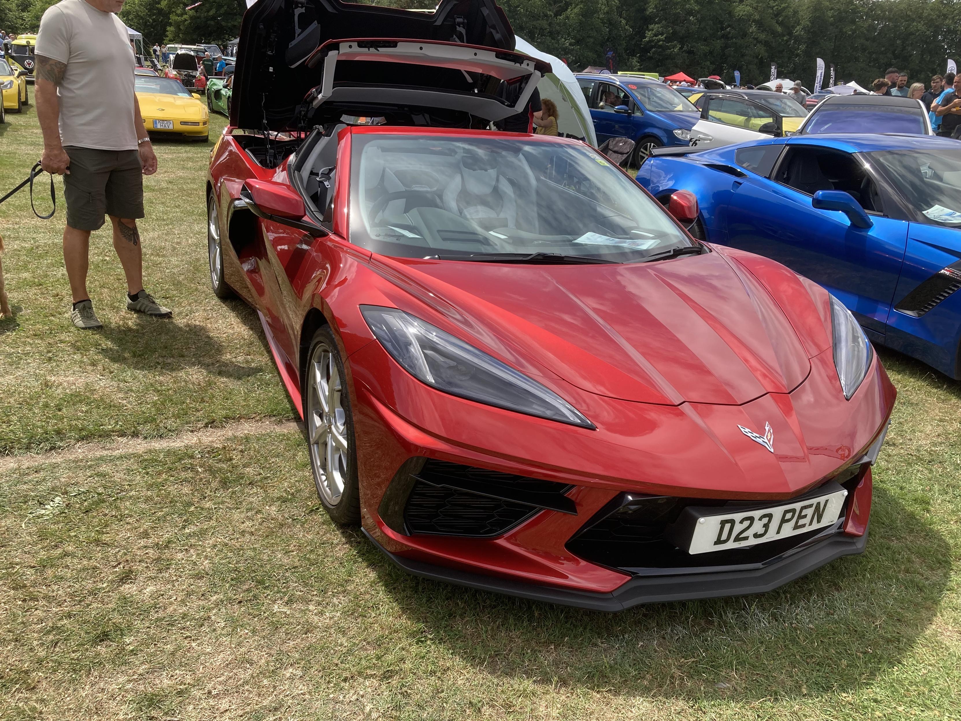 Red metallic Chevrolet Corvette C8 Stingray convertible, frontal view