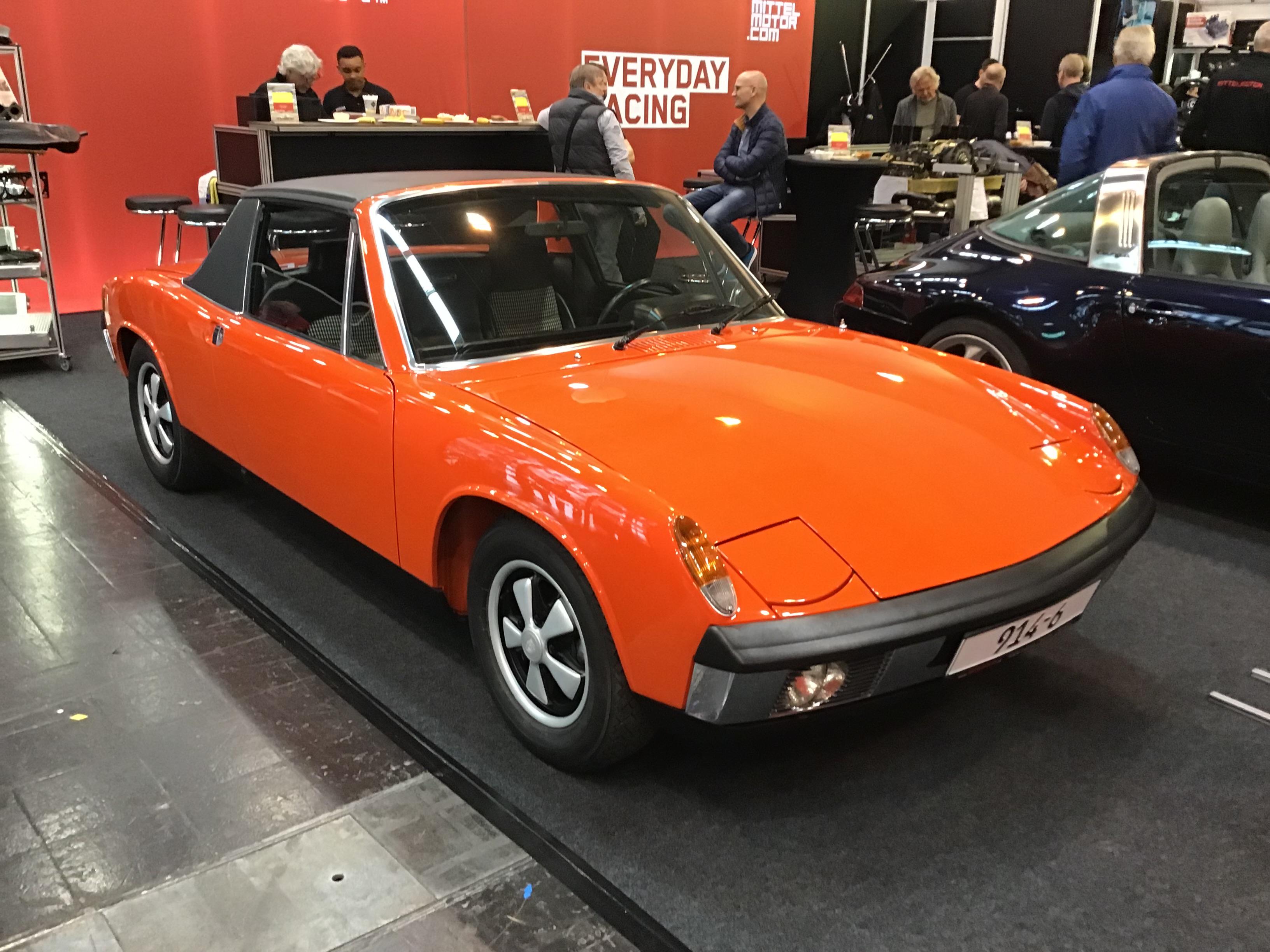 Orange VW-Porsche 914/6 with black Targa-style roof, front quarter view