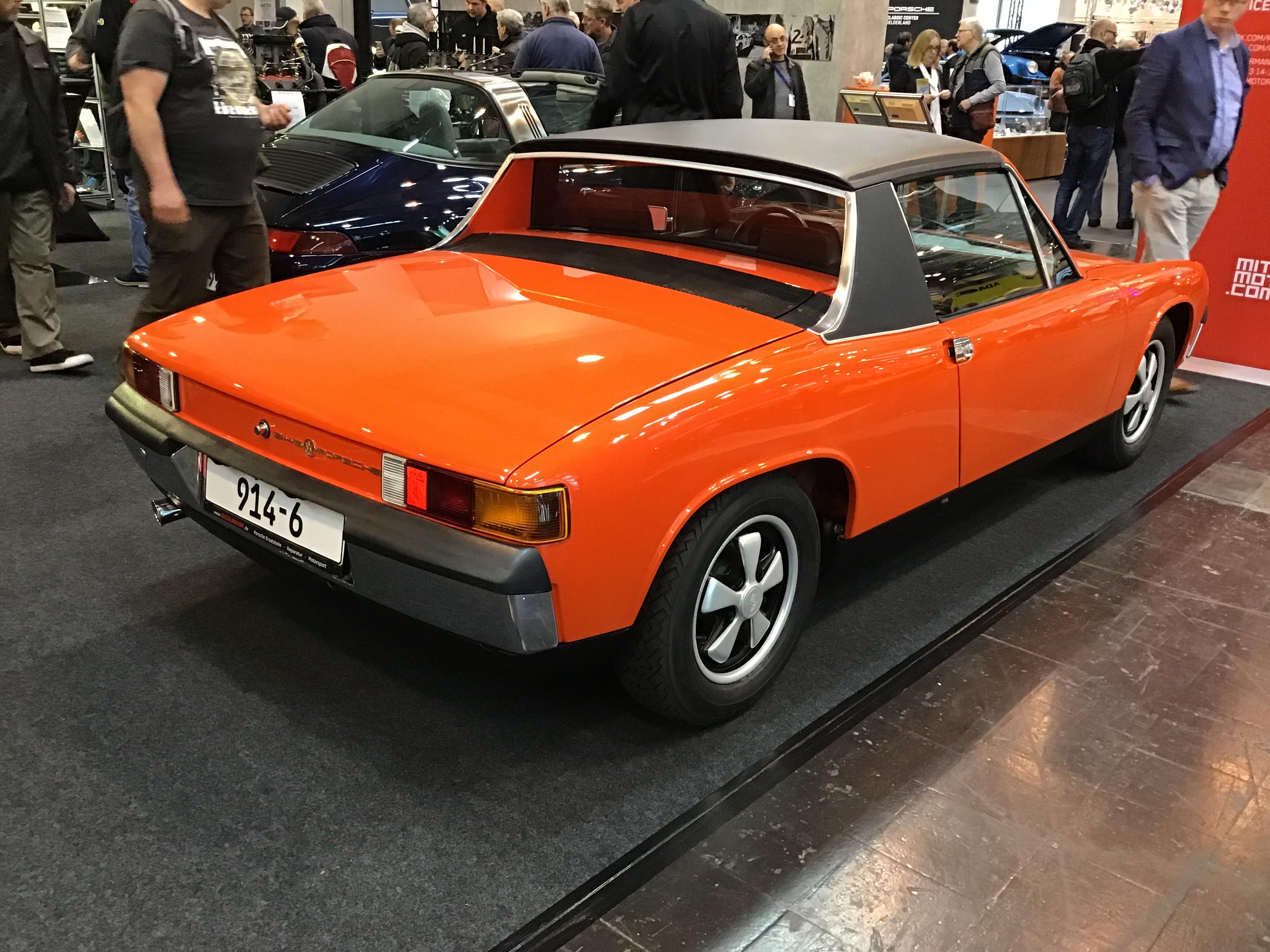 Orange VW-Porsche 914/6 with black Targa-style roof, rear quarter view