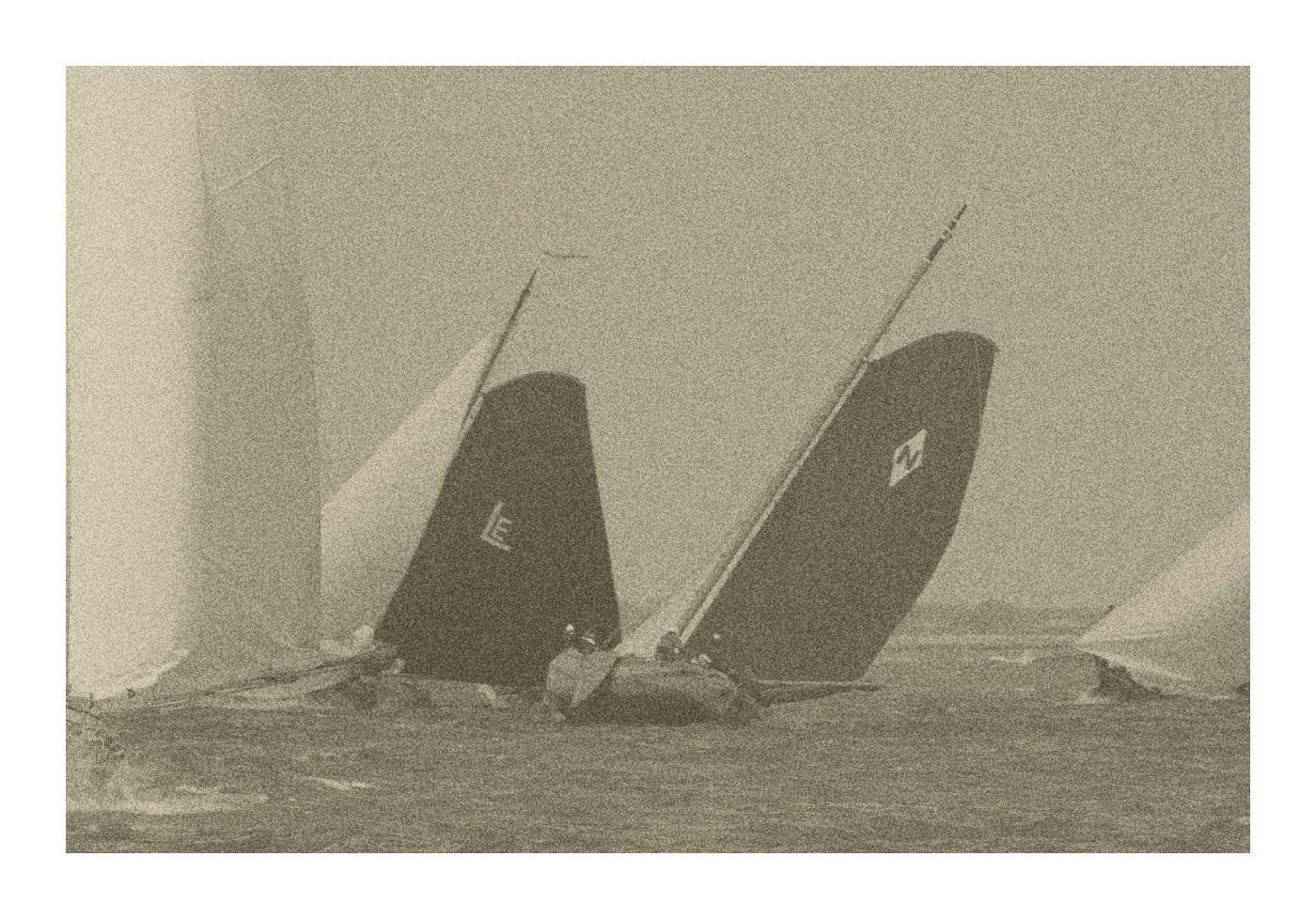 Skûtsjesilen on Frisian Waters. 4 traditional sailing ships, skûtsjes, in a regatta during strong winds. A very grainy image in sephia colors.